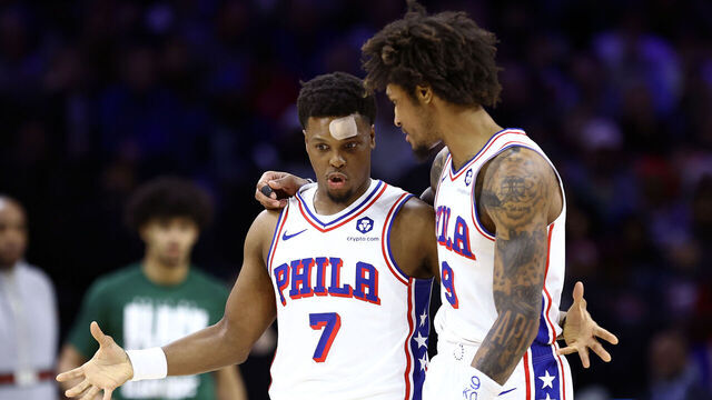 PHILADELPHIA, PENNSYLVANIA - FEBRUARY 25: Kyle Lowry #7 and Kelly Oubre Jr. #9 of the Philadelphia 76ers speak during the third quarter against the Milwaukee Bucks at the Wells Fargo Center on February 25, 2024 in Philadelphia, Pennsylvania.