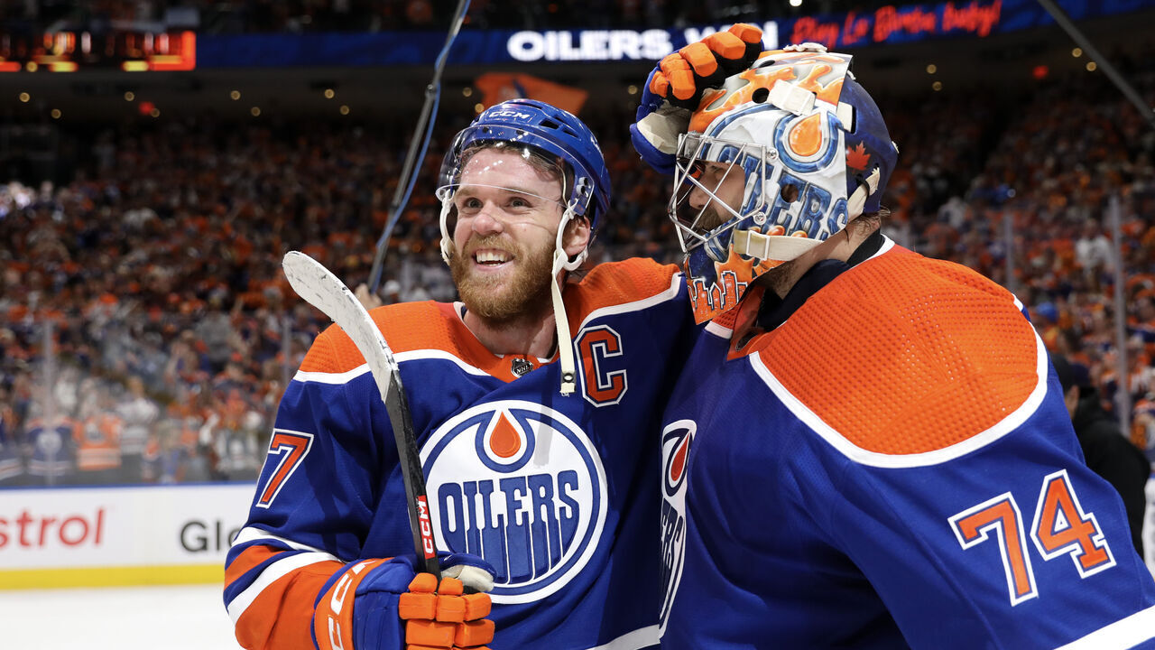 EDMONTON, CANADA - JUNE 02: Connor McDavid #97 and Stuart Skinner #74 of the Edmonton Oilers celebrate after beating the Dallas Stars 2-1 in Game Six of the Western Conference Final of the 2024 Stanley Cup Playoffs at Rogers Place on June 02, 2024 in Edmonton, Alberta, Canada.