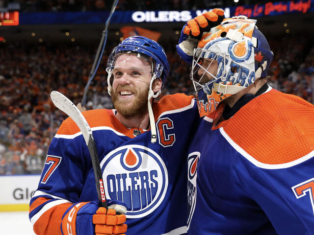 EDMONTON, CANADA - JUNE 02: Connor McDavid #97 and Stuart Skinner #74 of the Edmonton Oilers celebrate after beating the Dallas Stars 2-1 in Game Six of the Western Conference Final of the 2024 Stanley Cup Playoffs at Rogers Place on June 02, 2024 in Edmonton, Alberta, Canada.