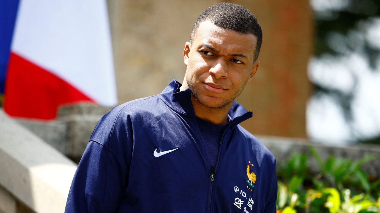 French forward Kylian Mbappe waits for the arrival of French President for a lunch at the team's training camp, as part of the team's preparation for the UEFA Euro 2024 European football championships in Clairefontaine-en-Yvelines on June 3, 2024.