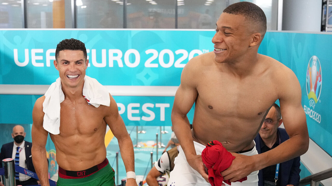BUDAPEST, HUNGARY - JUNE 23: Cristiano Ronaldo of Portugal speaks with Kylian Mbappe of France in the tunnel following the UEFA Euro 2020 Championship Group F match between Portugal and France at Puskas Arena on June 23, 2021 in Budapest, Hungary.
