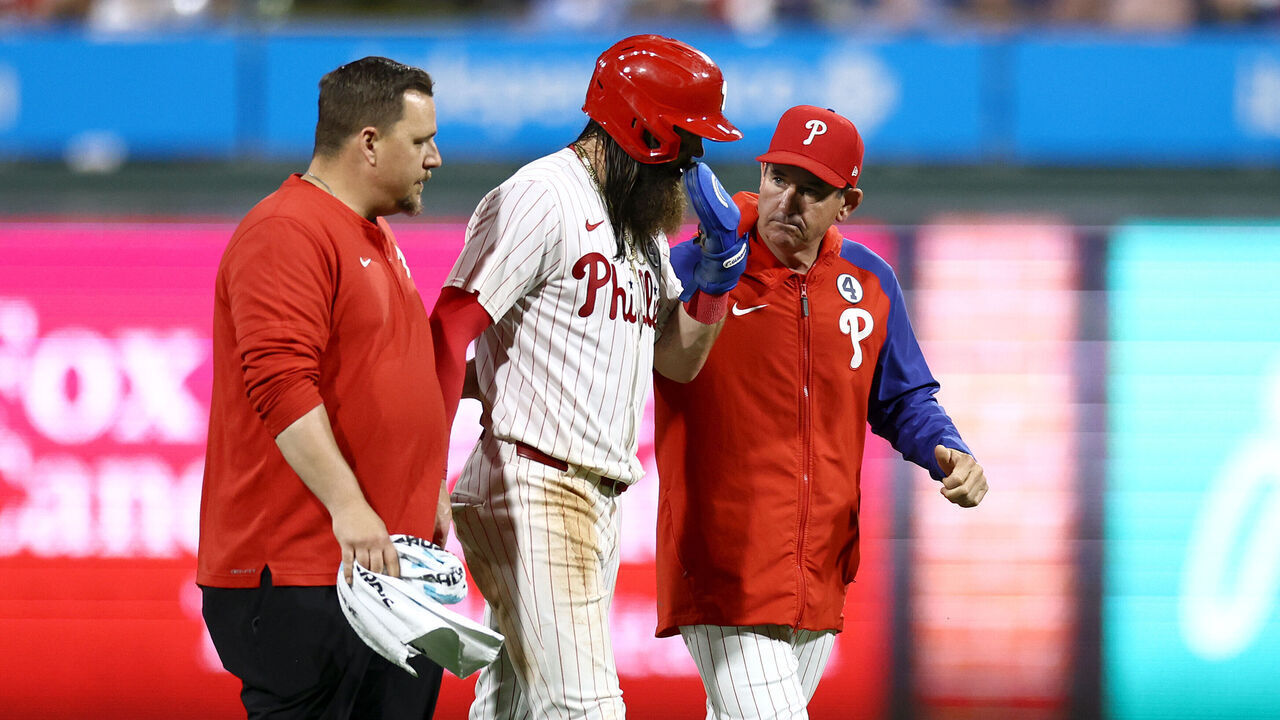 PHILADELPHIA, PENNSYLVANIA - JUNE 02: Brandon Marsh #16 of the Philadelphia Phillies (C) reacts following an injury during the eighth inning against the St. Louis Cardinals at Citizens Bank Park on June 02, 2024 in Philadelphia, Pennsylvania.