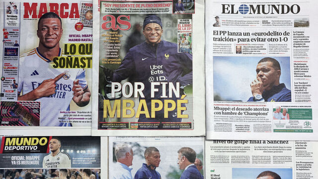 This picture taken on June 4, 2024 shows several Spanish newspapers' front pages a day after French forward Kylian Mbappe signed for Real Madrid football team. Kylian Mbappe signed a five-year deal to move to Real Madrid from Paris Saint-Germain yesterday and hailed the move as a "dream come true". The announcement is the culmination of Real's long courtship of one of the most prolific forwards in world football.