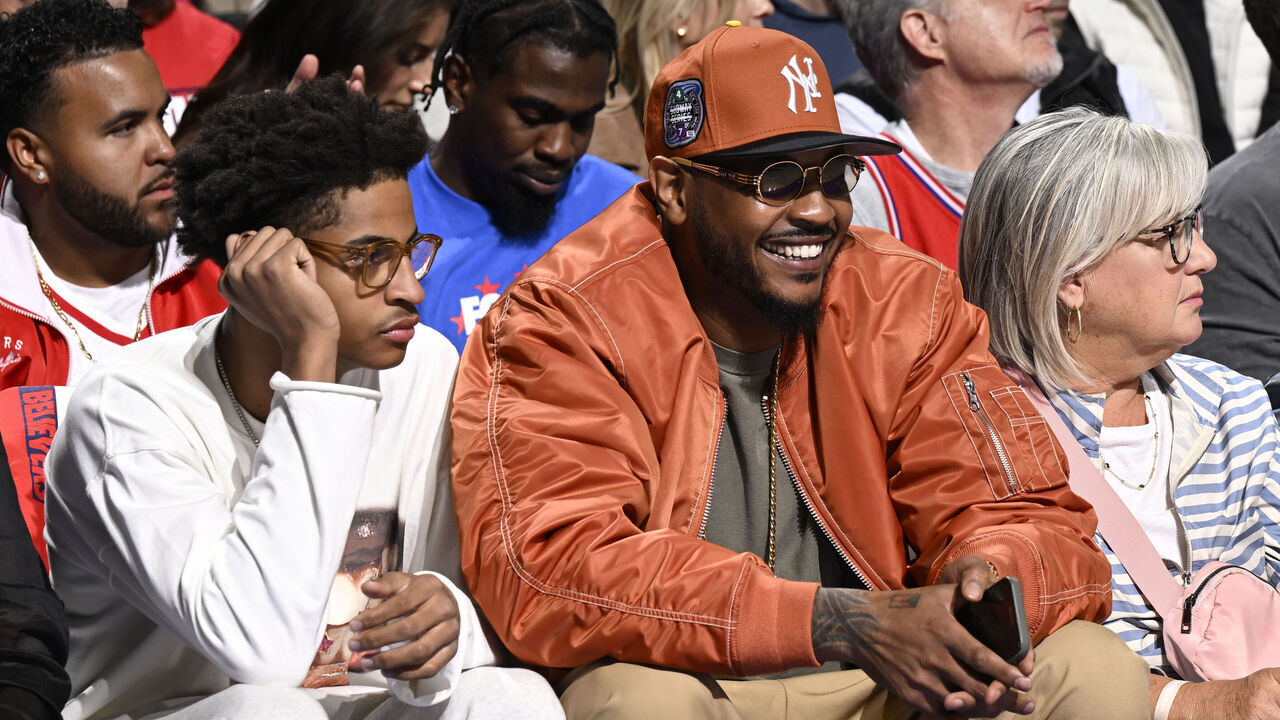 PHILADELPHIA, PA - APRIL 25: Carmelo Anthony and Kiyan Anthony attend the game between the New York Knicks and the Philadelphia 76ers during Round 1 Game 3 of the 2024 NBA Playoffs on April 25, 2024 at the Wells Fargo Center in Philadelphia, Pennsylvania NOTE TO USER: User expressly acknowledges and agrees that, by downloading and/or using this Photograph, user is consenting to the terms and conditions of the Getty Images License Agreement. Mandatory Copyright Notice: Copyright 2024 NBAE