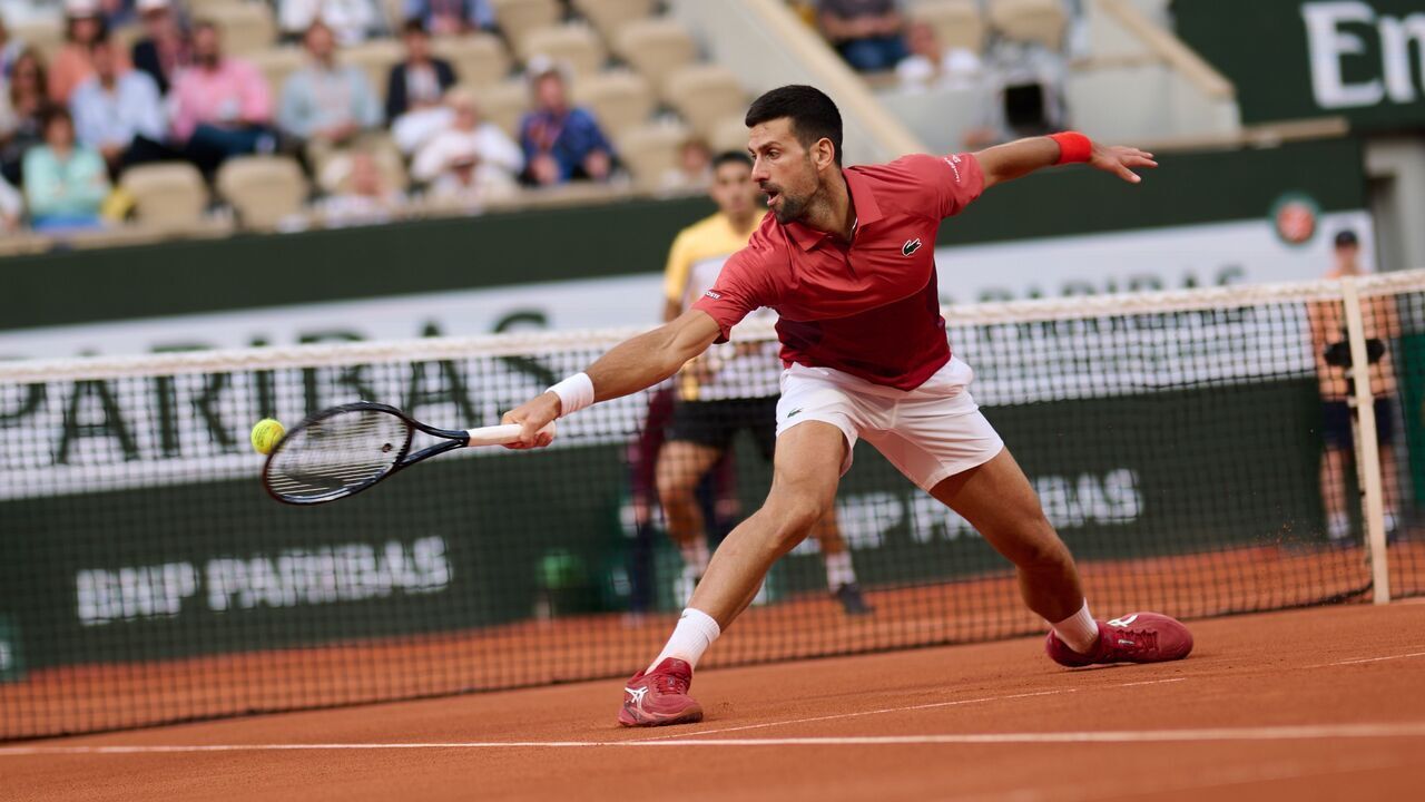 Novak Djokovic hits a return during the men's singles fourth round match between Novak Djokovic of Serbia and Francisco Cerundolo of Argentina at the French Open tennis tournament at Roland Garros, Paris, France, June 3, 2024.