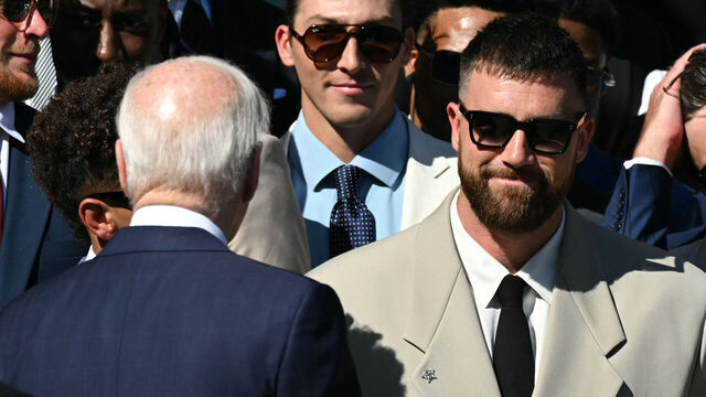 US President Joe Biden greets players including Kansas City Chiefs' tight end Travis Kelce (R) during a celebration for the Kansas City Chiefs, 2024 Super Bowl champions, on the South Lawn of the White House in Washington, DC, on May 31, 2024.
