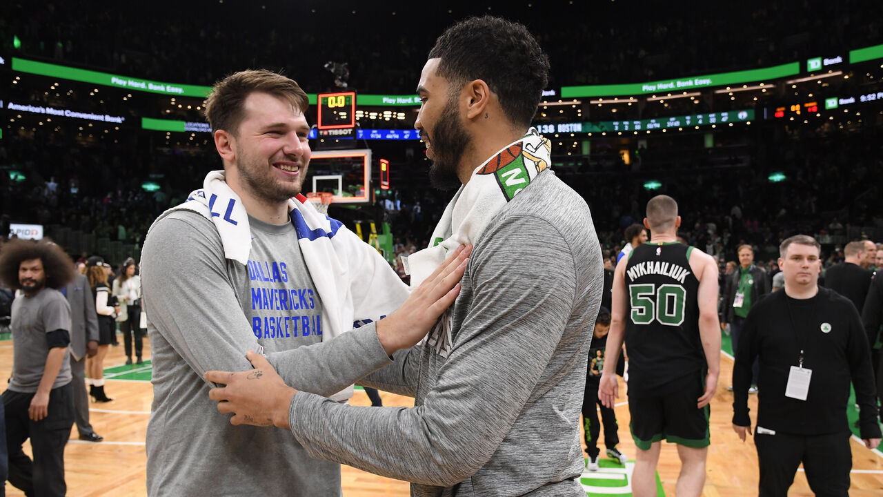 BOSTON, MA - MARCH 1: Jayson Tatum #0 of the Boston Celtics and Luka Doncic #77 of the Dallas Mavericks brace after the game on March 1, 2024 at the TD Garden in Boston, Massachusetts. Mandatory Copyright Notice: Copyright 2024 NBAE