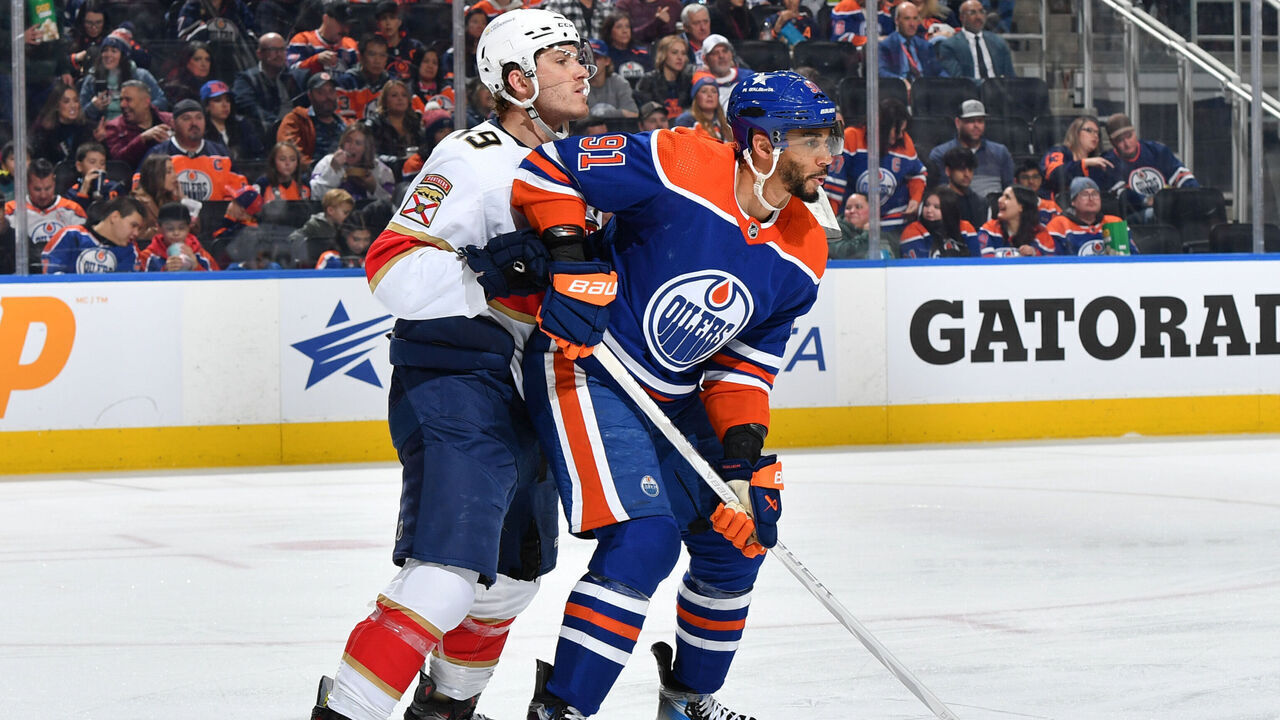 EDMONTON, CANADA - DECEMBER 16: Evander Kane #91 of the Edmonton Oilers and Matthew Tkachuk #19 of the Florida Panthers battle for position during the game at Rogers Place on December 16, 2023, in Edmonton, Alberta, Canada.