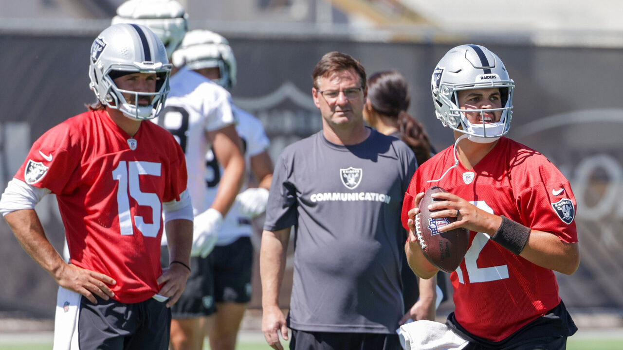 HENDERSON, NEVADA - JUNE 04: Quarterback Gardner Minshew #15 and quarterbacks coach Rich Scangarello of the Las Vegas Raiders watch as quarterback Aidan O'Connell #12 throws during an OTA offseason workout at the Las Vegas Raiders Headquarters/Intermountain Healthcare Performance Center on June 04, 2024 in Henderson, Nevada.
