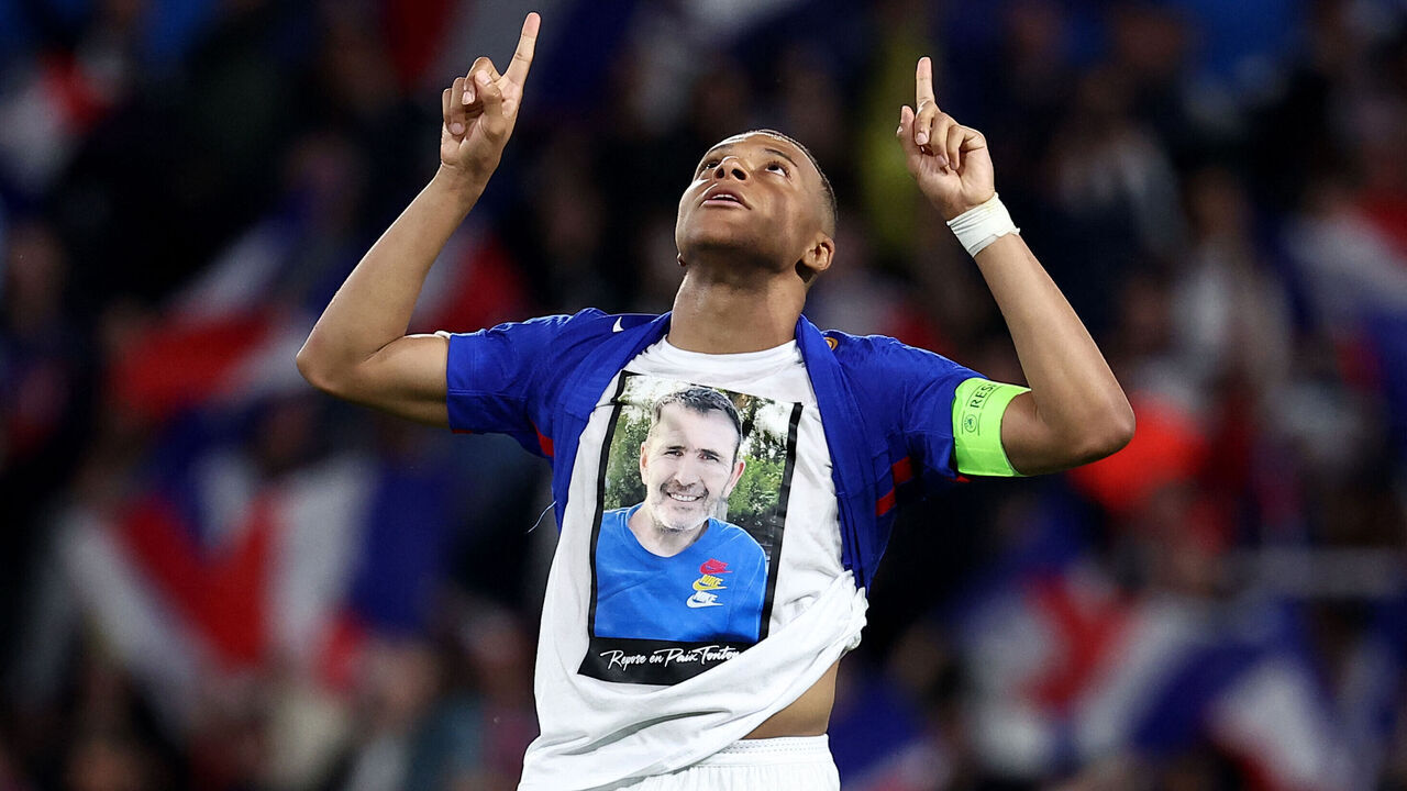 France's forward #10 Kylian Mbappe wears a t-shirt in tribute to a deceased relative as he celebrates after scoring his team's third goal during the International friendly football match between France and Luxembourg at Saint-Symphorien Stadium in Longeville-les-Metz, eastern France, on June 5, 2024.