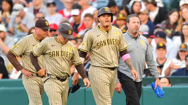 ANAHEIM, CA - JUNE 05: San Diego Padres third baseman Manny Machado (13) walks off the field with the trainer after being injured running to first base during the MLB game between the San Diego Padres and the Los Angeles Angels of Anaheim on June 5, 2024 at Angel Stadium of Anaheim in Anaheim, CA.