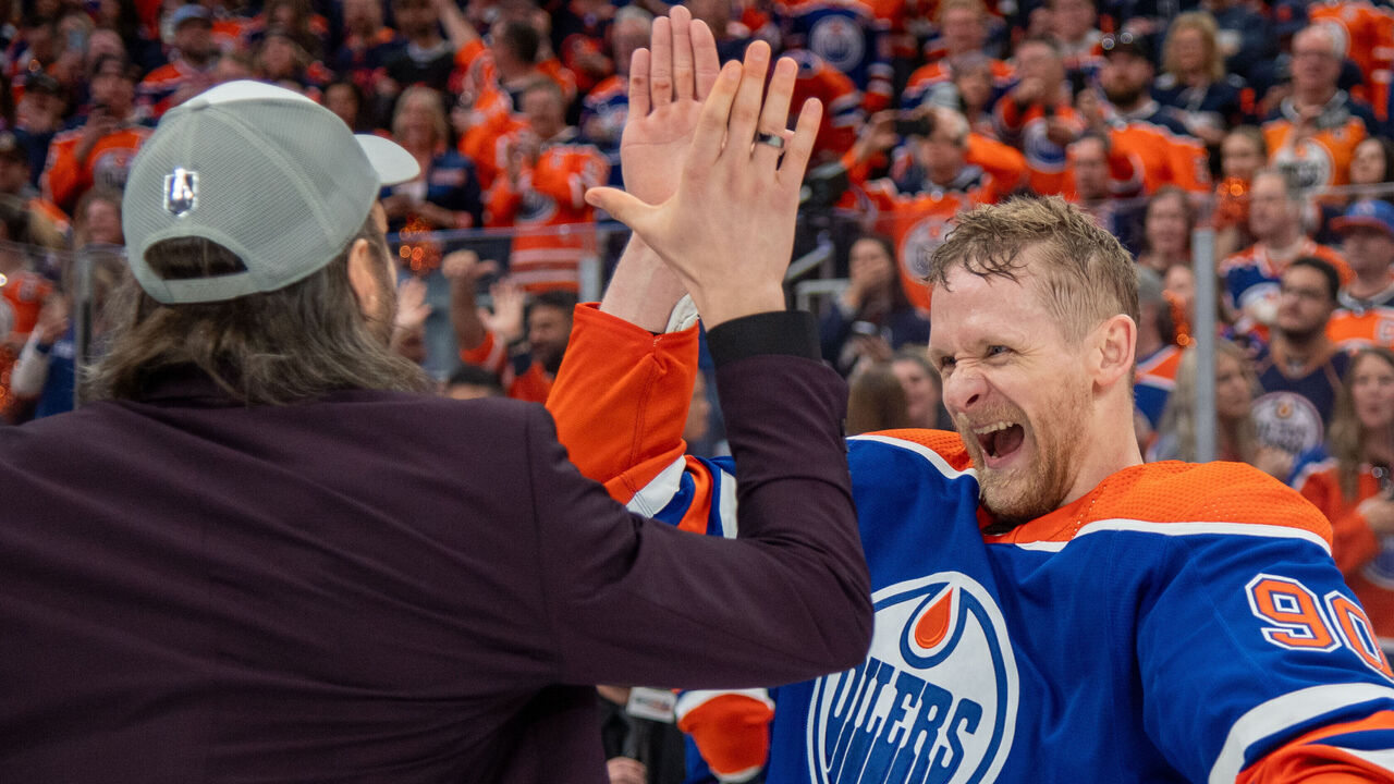 EDMONTON, CANADA - JUNE 02: Corey Perry #90 and Vincent Desharnais of the Edmonton Oilers celebrate after defeating the Dallas Stars in Game Six of the Western Conference Final of the 2024 Stanley Cup Playoffs at Rogers Place on June 2, 2024, in Edmonton, Alberta, Canada.