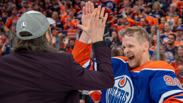 EDMONTON, CANADA - JUNE 02: Corey Perry #90 and Vincent Desharnais of the Edmonton Oilers celebrate after defeating the Dallas Stars in Game Six of the Western Conference Final of the 2024 Stanley Cup Playoffs at Rogers Place on June 2, 2024, in Edmonton, Alberta, Canada.