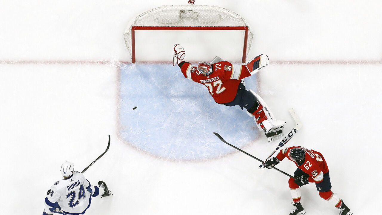 SUNRISE, FLORIDA - APRIL 23: Goaltender Sergei Bobrovsky #72 of the Florida Panthers defends the net with the help of teammate Brandon Montour #62 against Mathew Dumba #24 of the Tampa Bay Lightning in Game Two of the First Round of the 2024 Stanley Cup Playoffs at the Amerant Bank Arena on April 23, 2024 in Sunrise, Florida.