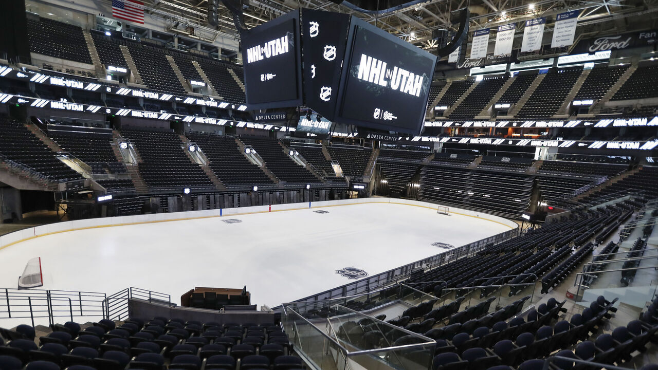 SALT LAKE CITY, UT - APRIL 19: The hockey rink at the Delta Center is seen with the "NHL in Utah" logos appearing on the signage on April 19, 2024 in Salt Lake City, Utah. The NHL has allowed the sale of the Arizona Coyotes and the team will relocate to Salt Lake City, Utah.