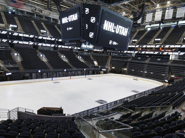 SALT LAKE CITY, UT - APRIL 19: The hockey rink at the Delta Center is seen with the "NHL in Utah" logos appearing on the signage on April 19, 2024 in Salt Lake City, Utah. The NHL has allowed the sale of the Arizona Coyotes and the team will relocate to Salt Lake City, Utah.