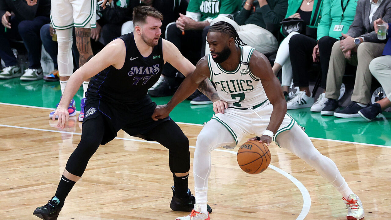 BOSTON, MASSACHUSETTS - JUNE 06: Jaylen Brown #7 of the Boston Celtics drives to the basket against Luka Doncic #77 of the Dallas Mavericks during the third quarter in Game One of the 2024 NBA Finals at TD Garden on June 06, 2024 in Boston, Massachusetts.