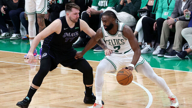 BOSTON, MASSACHUSETTS - JUNE 06: Jaylen Brown #7 of the Boston Celtics drives to the basket against Luka Doncic #77 of the Dallas Mavericks during the third quarter in Game One of the 2024 NBA Finals at TD Garden on June 06, 2024 in Boston, Massachusetts.