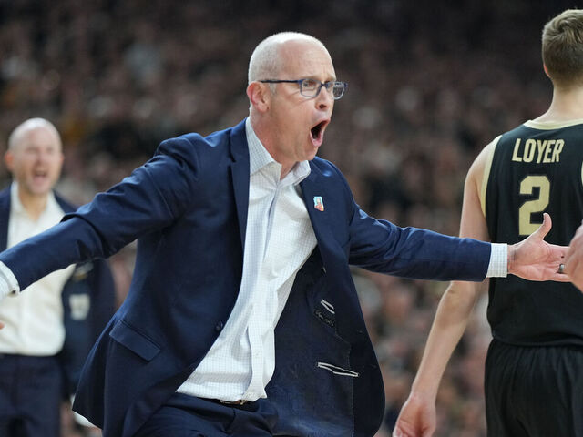 GLENDALE, ARIZONA - APRIL 08: Head coach Dan Hurley of the Connecticut Huskies celebrates a shot during the National College Basketball Championship game against the Purdue Boilermakers at State Farm Stadium on April 08, 2024 in Glendale, Arizona.