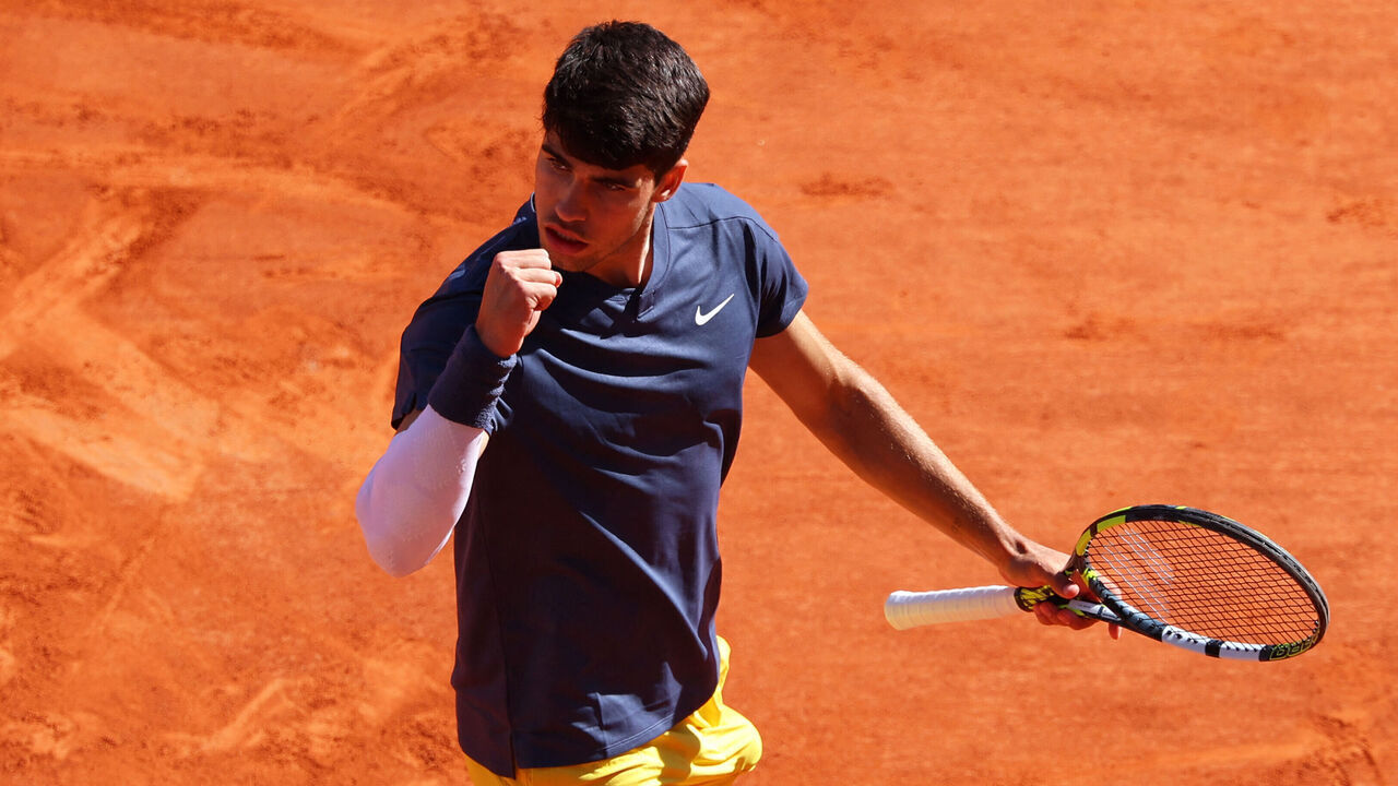 Spain's Carlos Alcaraz reacts after a point during his men's singles semi final match against Italy's Jannik Sinner on Court Philippe-Chatrier on day thirteen of the French Open tennis tournament at the Roland Garros Complex in Paris on June 7, 2024.