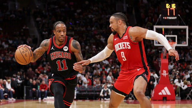 HOUSTON, TEXAS - MARCH 21: DeMar DeRozan #11 of the Chicago Bulls drives to the basket against Dillon Brooks #9 of the Houston Rockets in the second half at Toyota Center on March 21, 2024 in Houston, Texas.