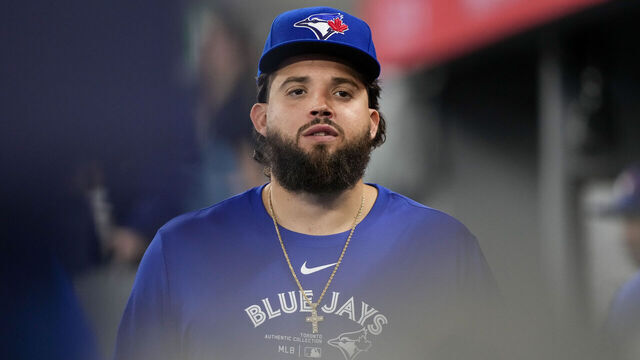 TORONTO, ON - APRIL 9: Alex Manoah #6 of the Toronto Blue Jays looks on from the dugout against the Seattle Mariners at the Rogers Centre on April 9, 2024 in Toronto, Ontario, Canada.