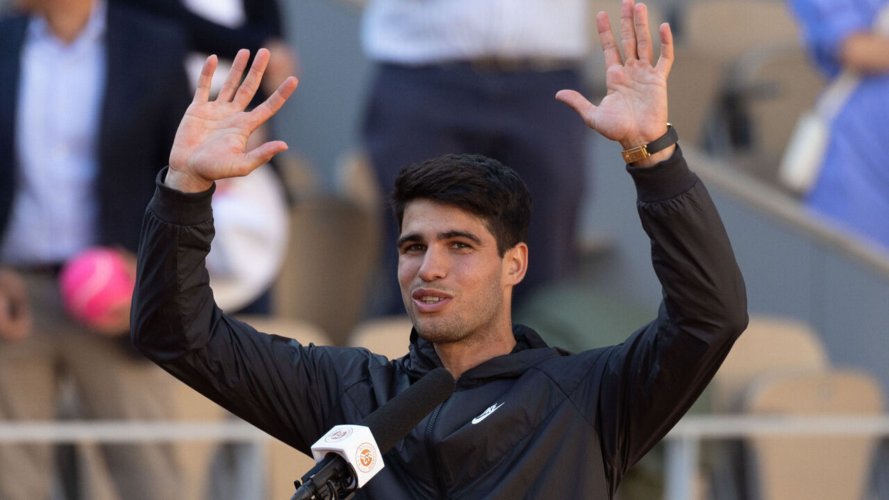 PARIS, FRANCE - JUNE 07: Carlos Alcaraz of Spain celebrates winning match point against Jannik Sinner of Italy in the Men's Singles Semi Final match on Day Thirteen of the 2024 French Open at Roland Garros on June 07, 2024 in Paris, France.