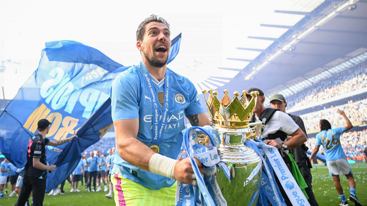 MANCHESTER, ENGLAND - MAY 19: Stefan Ortega of Manchester City celebrates with the Premier League Trophy after their team's victory in the Premier League match between Manchester City and West Ham United at Etihad Stadium on May 19, 2024 in Manchester, England.