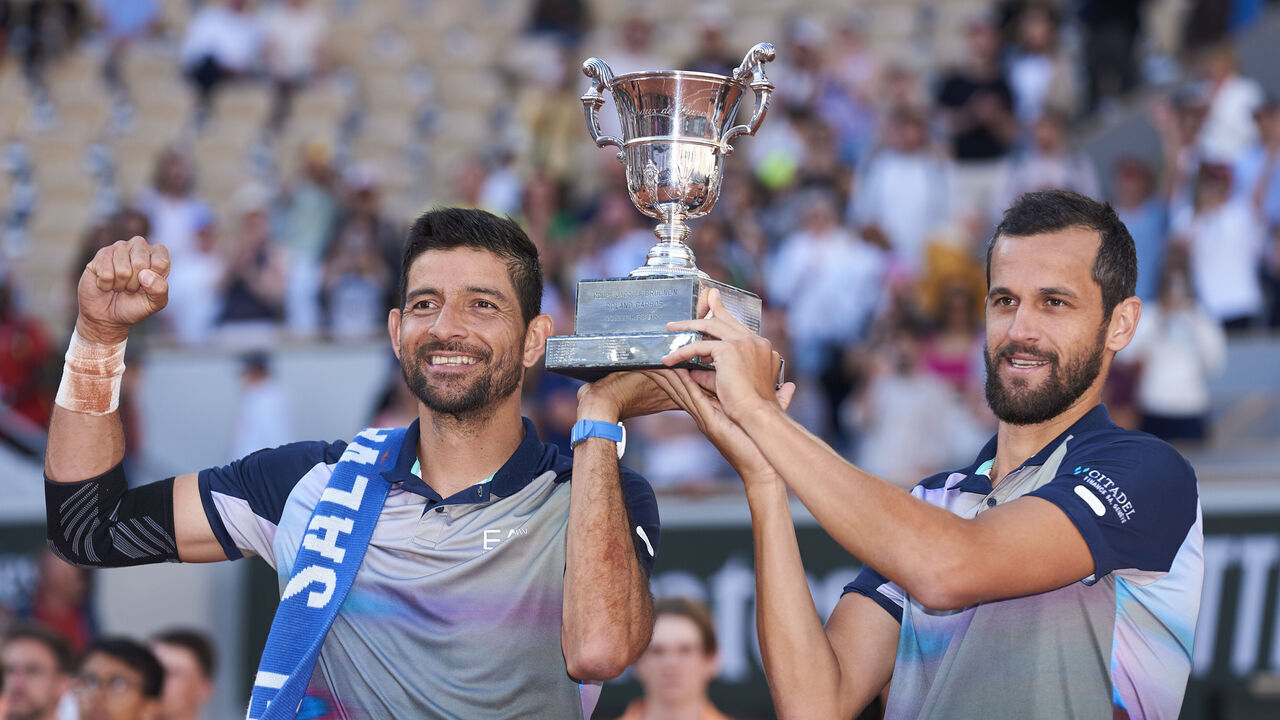 PARIS, FRANCE - JUNE 08: Mate Pavic of Croatia and Marcelo Arevalo of El Salvador celebrate with the trophy after victory against Andrea Vavassori of Italy and Simone Bolelli of Italy during the Men's Doubles Final match on Day 14 of the 2024 French Open at Roland Garros on June 08, 2024 in Paris, France.