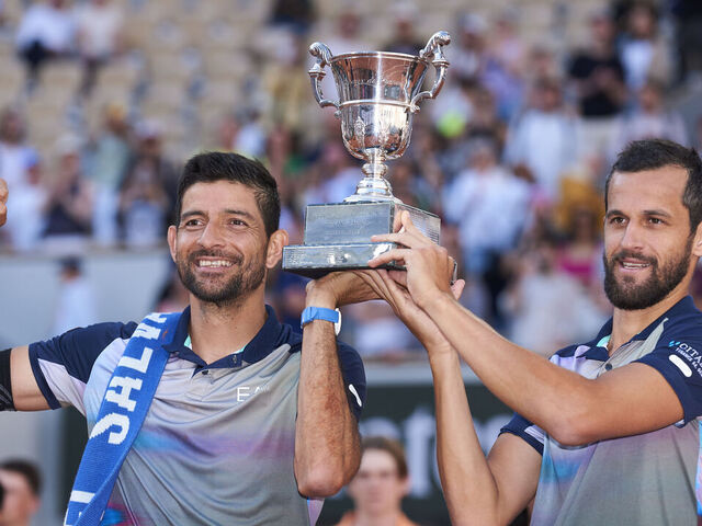 PARIS, FRANCE - JUNE 08: Mate Pavic of Croatia and Marcelo Arevalo of El Salvador celebrate with the trophy after victory against Andrea Vavassori of Italy and Simone Bolelli of Italy during the Men's Doubles Final match on Day 14 of the 2024 French Open at Roland Garros on June 08, 2024 in Paris, France.