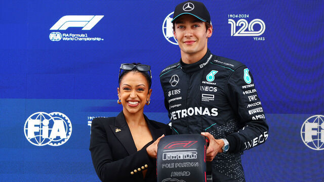 MONTREAL, QUEBEC - JUNE 08: Liza Koshy awards Pole position qualifier George Russell of Great Britain and Mercedes, with the Pirelli Pole Position Award after qualifying ahead of the F1 Grand Prix of Canada at Circuit Gilles Villeneuve on June 08, 2024 in Montreal, Quebec.