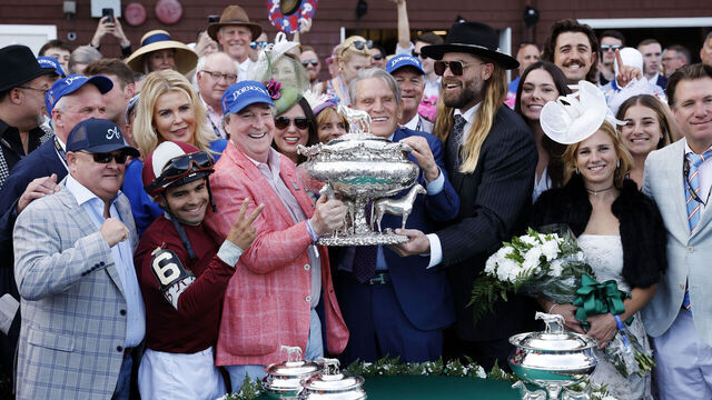 SARATOGA SPRINGS, NEW YORK - JUNE 08: Owner Jayson Werth raises the trophy after Dornoch with Luis Saez up wins the 156th running of the Belmont Stakes at Saratoga Race Course on June 08, 2024 in Saratoga Springs, New York. The race was moved to Saratoga while Belmont Park undergoes renovations.