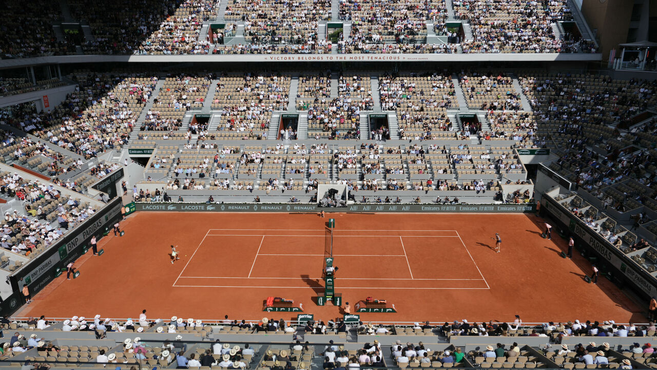This photograph shows a view of Court Philippe-Chatrier as Italy's Jasmine Paolini (centre L) and Russia's Mirra Andreeva play their women's singles semi final match on day twelve of the French Open tennis tournament at the Roland Garros Complex in Paris on June 6, 2024.