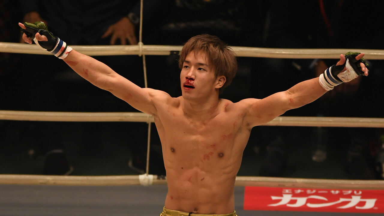 SAITAMA, JAPAN - DECEMBER 29: Kai Asakura of Japan celebrates his TKO victory in the bout against Kizaemon Saiga of Japan during the RIZIN Fighting World Grand-Prix 2017 2nd Round at Saitama Super Arena on December 29, 2017 in Saitama, Japan.