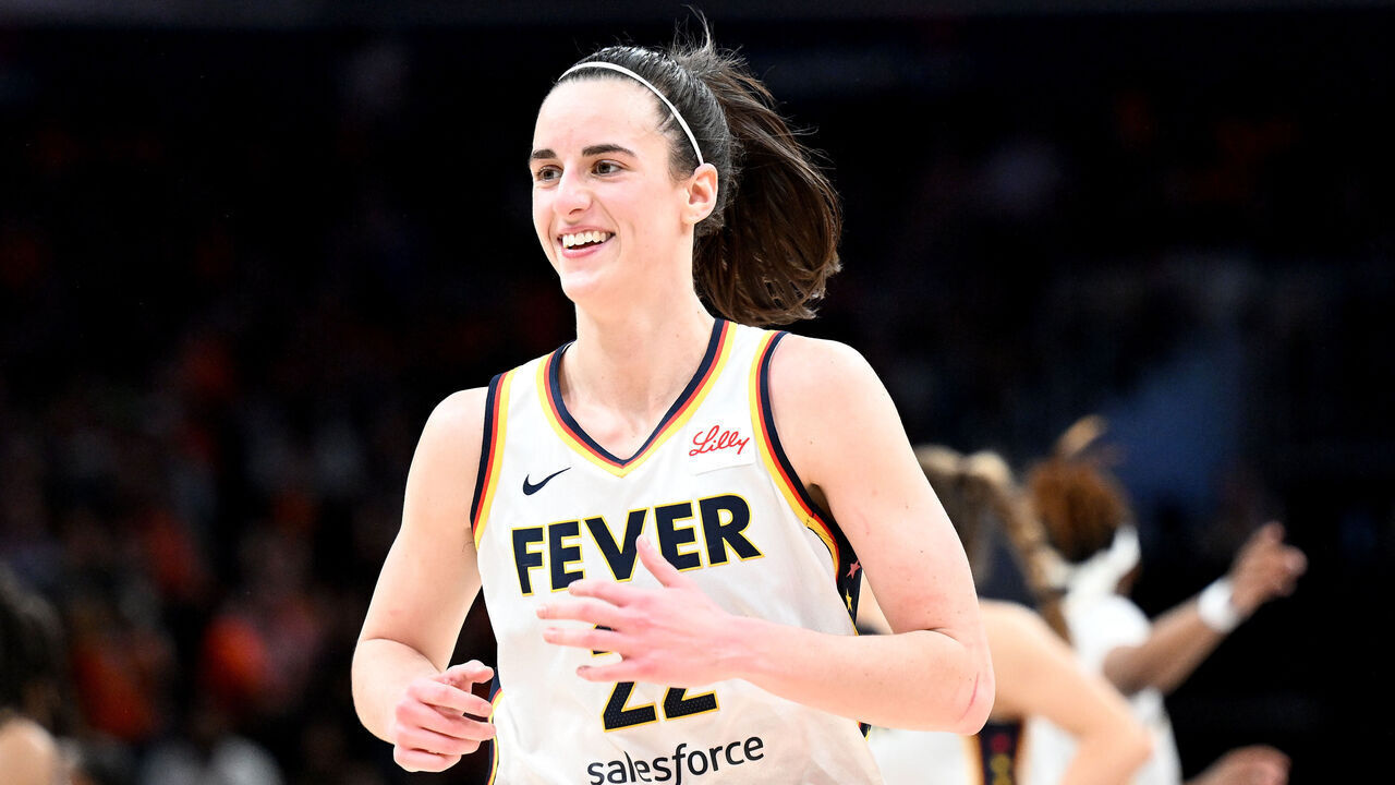 WASHINGTON, DC - JUNE 07: Caitlin Clark #22 of the Indiana Fever celebrates during the game against the Washington Mystics at Capital One Arena on June 07, 2024 in Washington, DC.