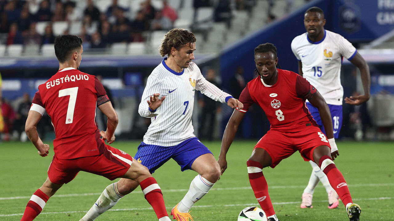 France's midfielder #07 Antoine Griezmann (C) fights for the ball with Canada's midfielder #08 Ismael Kone (2R) and Canada's midfielder #07 Stephen Eustaquio (L) during the International friendly football match between France and Canada at the Matmut Atlantique stadium in Bordeaux, on June 9, 2024.
