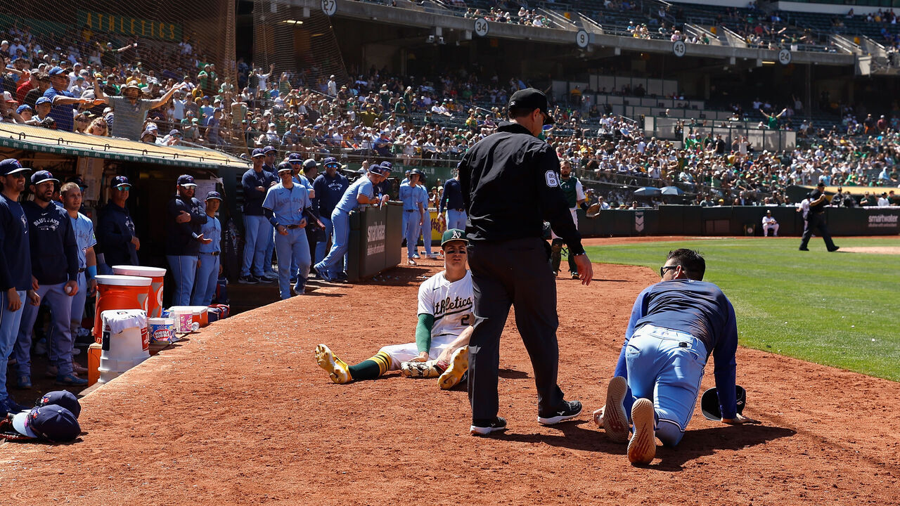 OAKLAND, CALIFORNIA - JUNE 09: First baseman Tyler Soderstrom #21 of the Oakland Athletics looks on after colliding with Yusei Kikuchi #16 of the Toronto Blue Jays in foul territory in the top of the tenth inning at Oakland Coliseum on June 09, 2024 in Oakland, California.