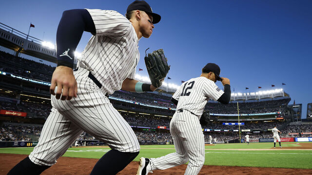 NEW YORK, NEW YORK - JUNE 09: Aaron Judge #99 and Trent Grisham #12 of the New York Yankees take the field before the sixth inning at Yankee Stadium on June 09, 2024 in the Bronx borough of New York City.