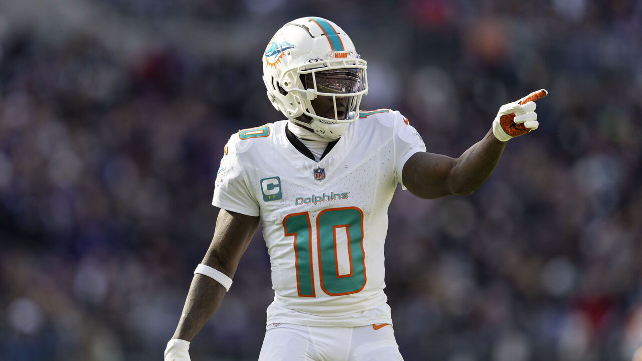 BALTIMORE, MARYLAND - DECEMBER 31: Tyreek Hill #10 of the Miami Dolphins signals as he lines up during an NFL football game between the Baltimore Ravens and the Miami Dolphins at M&T Bank Stadium on December 31, 2023 in Baltimore, Maryland.