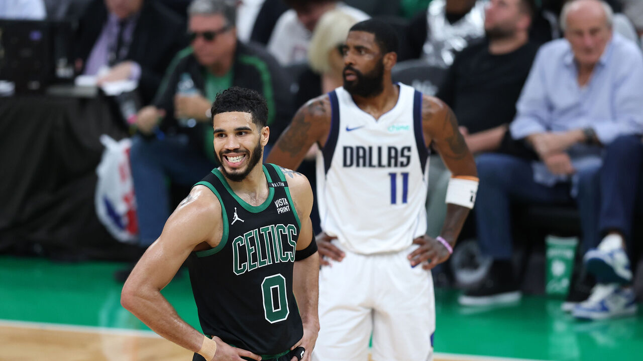 BOSTON, MASSACHUSETTS - JUNE 09: Jayson Tatum #0 of the Boston Celtics reacts in front of Kyrie Irving #11 of the Dallas Mavericks during the second quarter in Game Two of the 2024 NBA Finals at TD Garden on June 09, 2024 in Boston, Massachusetts.