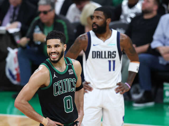 BOSTON, MASSACHUSETTS - JUNE 09: Jayson Tatum #0 of the Boston Celtics reacts in front of Kyrie Irving #11 of the Dallas Mavericks during the second quarter in Game Two of the 2024 NBA Finals at TD Garden on June 09, 2024 in Boston, Massachusetts.