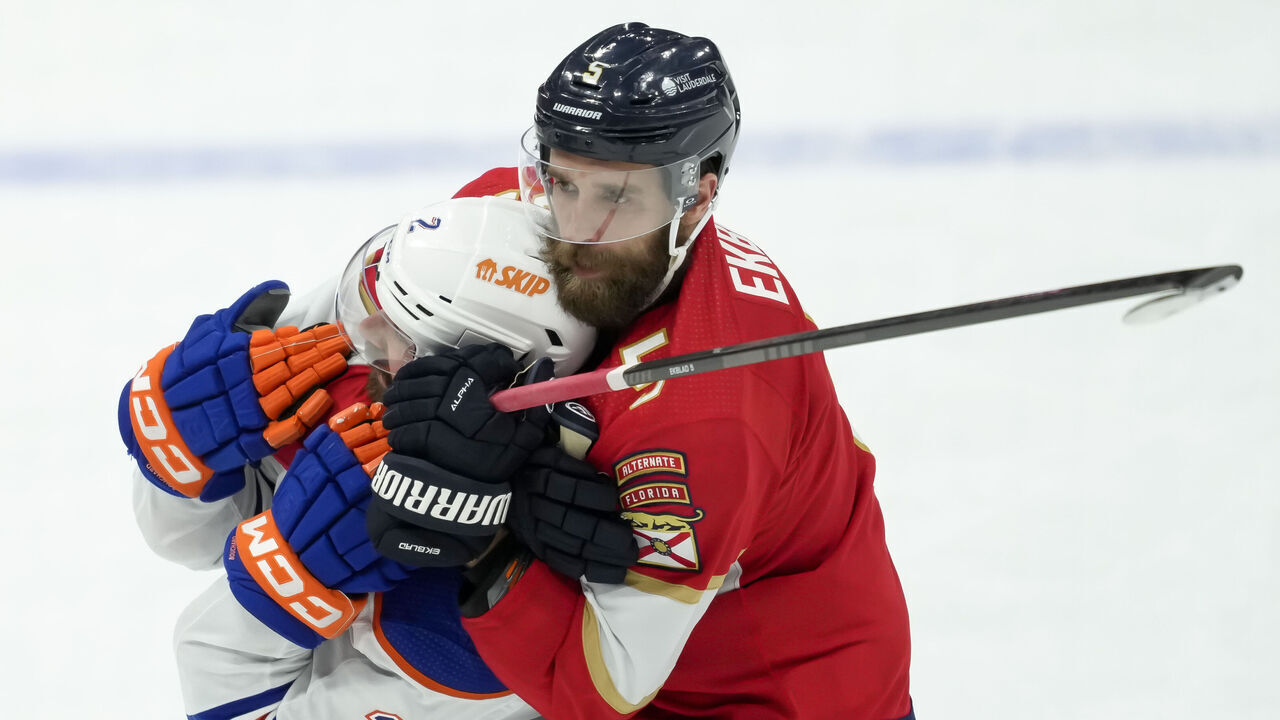 SUNRISE, FL - JUNE 10: Edmonton Oilers defenseman Evan Bouchard (2) and Florida Panthers defenseman Aaron Ekblad (5) fight during the NHL Stanley Cup Finals, Game 2 between the Florida Panthers and Edmonton Oilers on June 10th, 2024 at Amerant Bank Arena in Sunrise, FL.