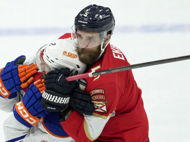 SUNRISE, FL - JUNE 10: Edmonton Oilers defenseman Evan Bouchard (2) and Florida Panthers defenseman Aaron Ekblad (5) fight during the NHL Stanley Cup Finals, Game 2 between the Florida Panthers and Edmonton Oilers on June 10th, 2024 at Amerant Bank Arena in Sunrise, FL.
