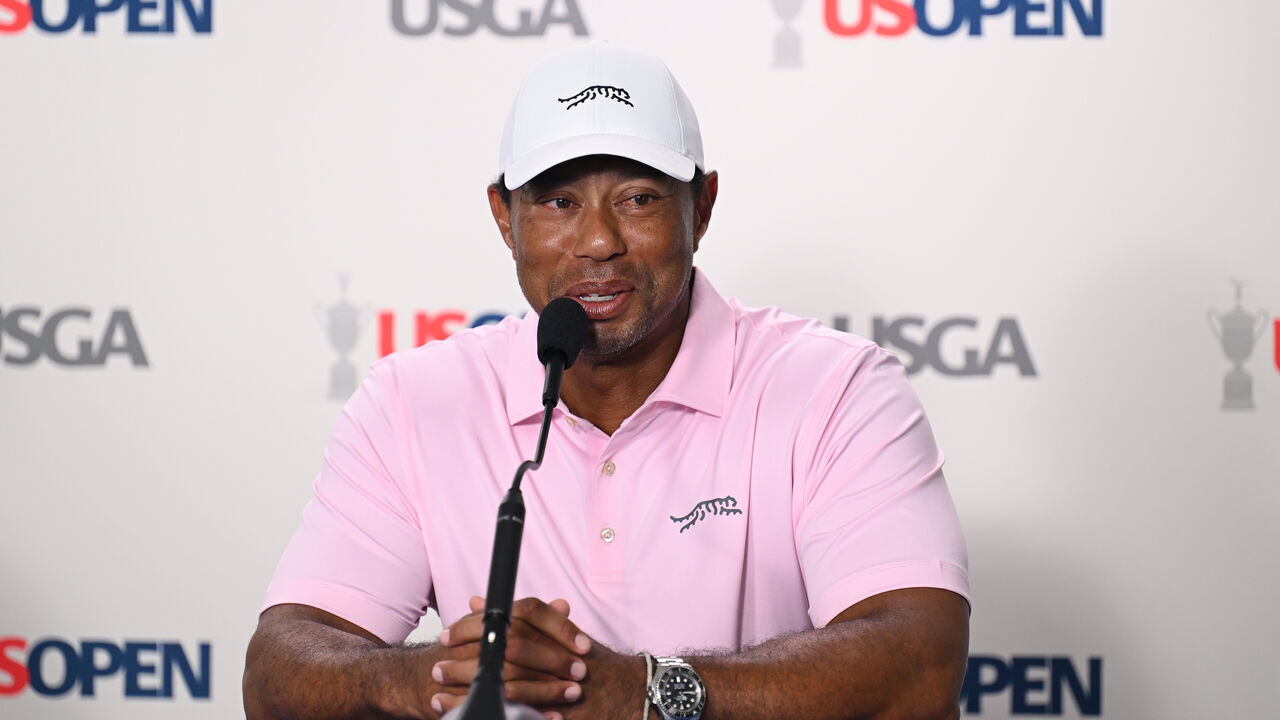 PINEHURST, NORTH CAROLINA - JUNE 11: Tiger Woods of the United States speaks to the media during a practice round prior to the U.S. Open at Pinehurst Resort on June 11, 2024 in Pinehurst, North Carolina.