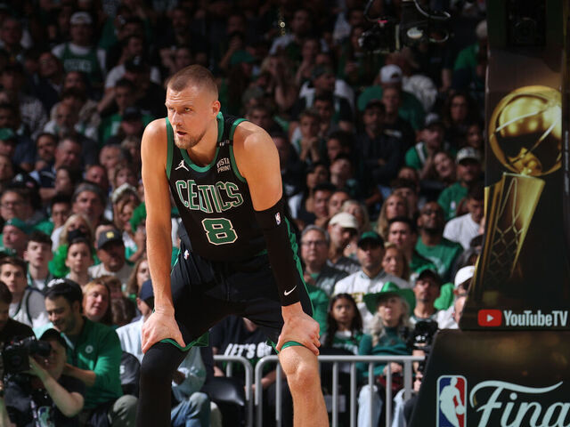 BOSTON, MA - JUNE 9: Kristaps Porzingis #8 of the Boston Celtics looks on during the game against the Dallas Mavericks during Game 1 of the 2024 NBA Finals on June 9, 2024 at the TD Garden in Boston, Massachusetts. Mandatory Copyright Notice: Copyright 2024 NBAE