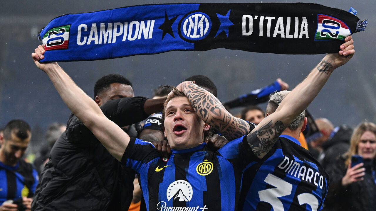 MILAN, ITALY - APRIL 22: Nicolo' Barella of Internazionale celebrates winning the 2024 Scudetto championship title during the Serie A TIM match between AC Milan and FC Internazionale at Stadio Giuseppe Meazza on April 22, 2024 in Milan, Italy.