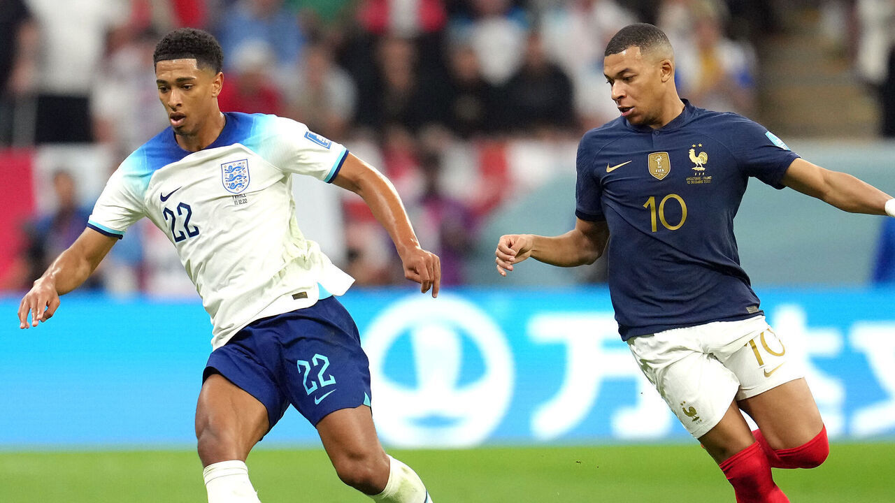 England's Jude Bellingham (left) and France's Kylian Mbappe battle for the ball during the FIFA World Cup Quarter-Final match at the Al Bayt Stadium in Al Khor, Qatar. Picture date: Saturday December 10, 2022.