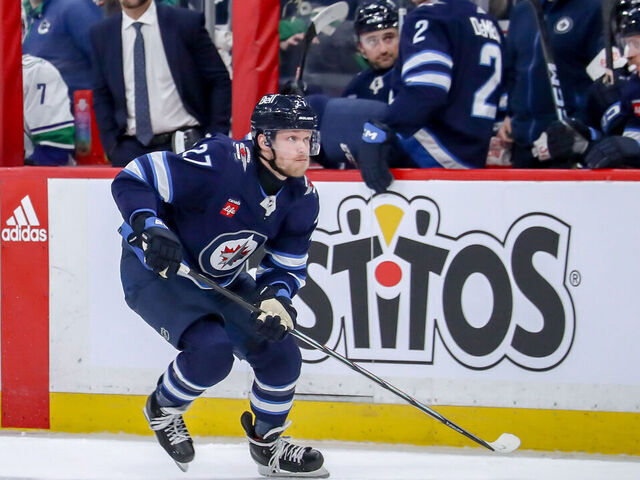 WINNIPEG, CANADA - APRIL 18: Nikolaj Ehlers #27 of the Winnipeg Jets follows the play down the ice during second period action against the Vancouver Canucks at the Canada Life Centre on April 18, 2024 in Winnipeg, Manitoba, Canada. The Jets defeated the Canucks 4-2.