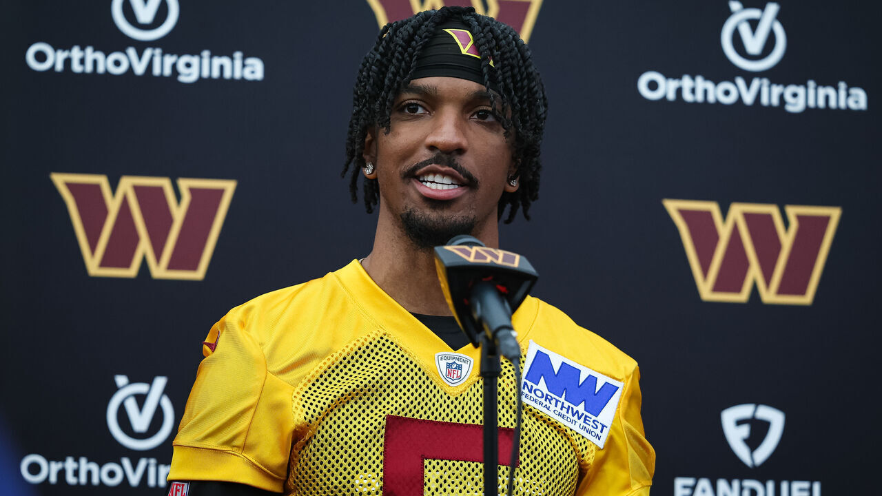 ASHBURN, VA - MAY 10: Jayden Daniels #5 of the Washington Commanders speaks with the media during Washington Commanders Rookie Minicamp at OrthoVirginia Training Center on May 10, 2024 in Ashburn, Virginia.