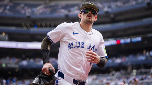 TORONTO, ON - MAY 18: Cavan Biggio #8 of Toronto Blue Jays takes the field to warm up ahead of playing the Tampa Bay Rays in their MLB game at the Rogers Centre on May 18, 2024 in Toronto, Ontario, Canada.